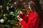 Сlipart Little girl decorating kid tree decoration trimming photo  BillionPhotos