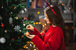 Сlipart Little girl decorating kid tree decoration trimming photo  BillionPhotos