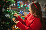 Сlipart Little girl decorating kid tree decoration trimming photo  BillionPhotos