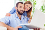 Сlipart Cheerful young couple working on laptop net the laptop leisure photo  BillionPhotos